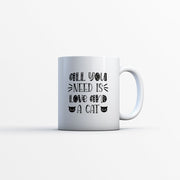 all you need is love and a cat Coffee Mug